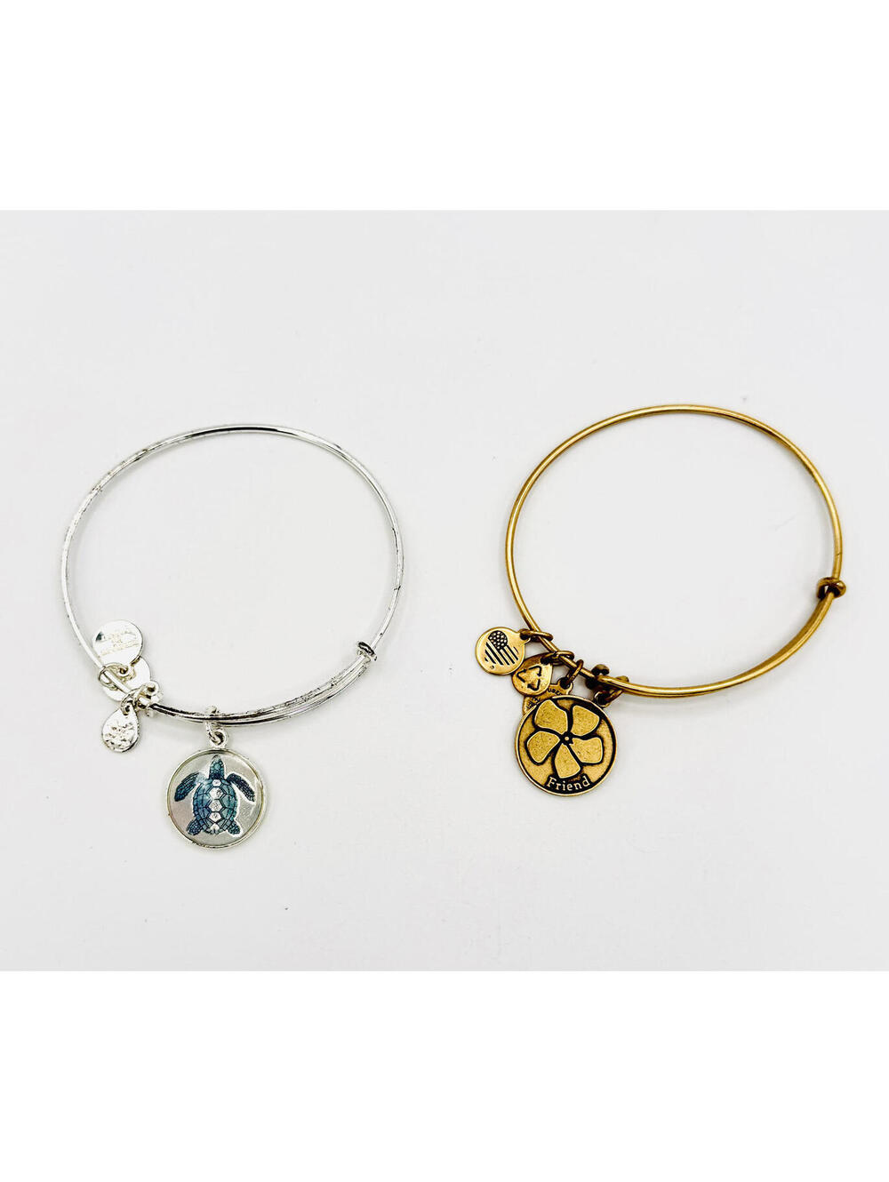 2 Alex and Ani  1 - gold tone Friends Flower Basket  2 - Silver tone sea turtle